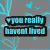 A static image with a gray background featuring light blue floral and heart patterns, displaying four text blocks in cyan lettering.