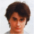 Two side-by-side pixelated portraits of a person with short brown hair against light backgrounds, one darker and one lighter.