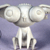 Pixelated static image of a white abstract structure with circular elements on top and vertical supports below against a purple background.