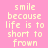 Pixelated text on a pink background reads "smile because life is too short to frown" in two identical vertical