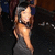 A woman in a dark dress with shoulder-length hair poses against a blurred background, her head turning slightly left to right across frames.