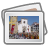 A framed photograph showing a pixelated outdoor scene with buildings under a blue sky, displayed within a digital interface.