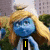Blue-skinned Smurf character with long blonde hair and white hat in four variations showing text changes.