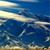 Pixelated abstract composition of horizontal bands in blue, white, and beige with scattered darker blue and gray patches, no discernible subjects or text.