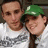 Two people in white shirts and green caps pose together, with red text reading "I Love You" and "9/3/07" visible on the image.