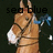 Pixelated image of a light brown anthropomorphic animal with long ears, wearing white gloves and holding blue fish against dark background.