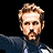 Pixelated image of a man with light brown hair and beard in three sequential poses, text 'BLADE TRINITY' below on black background.