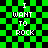 Green and black checkered background with white pixelated text reading "I WANT TO ROCK" in four identical arranged in a