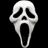 A pixelated white ghost mask with black eye and mouth openings on a black background, next to pink text reading "I" and "BOO!" on an orange backdrop.