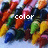 Colorful crayons arranged in a with text overlays reading 'color', 'my', and 'world.' on separate sections