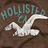 Pixelated icon with 'HOLLYWOOD' text above a white winged figure on brown background.