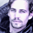 Pixelated static image of a person's face with dark hair and light skin, rendered in low-resolution 48x48 pixels with visible dithering and color banding.