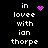 Black background with white pixelated text reading "in lovee with ian thorpe" and three distinct purple pixel art symbols: a solid heart, a starburst, and a dotted circle.