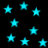 A black background filled with scattered cyan stars of varying sizes, some appearing blurred or faded.
