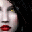 A static image of a woman's face with red lips and yellow eyes, overlaid with pixelated text reading "I'LL HOLD MY BREATH UNTIL YOU COME HOME" in alternating colors.