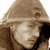 Static pixelated image of a person wearing a wide-brimmed hat with visible facial features and dark clothing, rendered in low resolution.