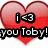 A pixelated red heart with black-outlined white text reading 'i <3 you Toby!' overlaid on top.
