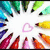 Pixelated static image with a white central area surrounded by colorful pixel clusters in blue, green, yellow, orange, red, and purple hues.