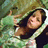 A pixelated image of a person with long dark hair wearing a hooded garment, with green text reading "I love Amanda" overlaid on the right side.