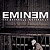 A split-frame contact sheet showing two animated frames of an Eminem-themed buddy icon with pixelated text and a green background frame.