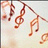 Animated sequence of brown musical notes hanging from a branch against a light background with subtle blurred shapes.