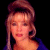 A pixelated image of a person with light brown hair styled up, wearing dark clothing against a black background on the left side and green text reading 'Original Icons .com' on the right.