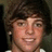 A pixelated image of a person with brown hair and a white shirt, alongside red text reading 'RYAN SHECKLER' and 'MAJOR HOTTIE' on black and gray backgrounds.