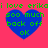 A pink background with four blue hearts containing green text reading "i love erikai love erika 500 much back off ok" arranged in a two-by-two