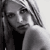 Static grayscale pixel art of a person's face with visible hair and clothing details, rendered in low resolution with dithering effects on the background.