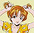 Pixelated cartoon character with brown hair, blue eyes, and a yellow outfit holding a yellow object against a light background.