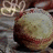 Pixelated image of a baseball with text overlays on black background, featuring mixed-case and stylized text.