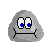 Pixelated gray cartoon character with blue eyes and black mouth lines, shown in two expressions: neutral and tongue-out.