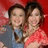 Two people pose closely together against a red background, with text reading "Miley and Emily" on the right side.