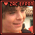 Pixelated square icon with orange border, featuring a person's face and text 'ZAC EFRON' above a red heart symbol.