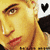 A pixelated image of a person with light skin and blonde hair, featuring black heart symbols in the top corners.