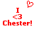 Red pixelated text and symbols on white background: 'I <3 Chester!' with a heart symbol above the 'I' in two identical side-by-side layouts.