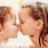 Two people with brown hair kiss on a white background, rendered in pixelated style.