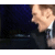 Animated contact sheet showing three frames of a man in formal attire with exaggerated facial expressions against dark background