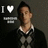 Pixelated image of a person in profile wearing dark clothing with white collar, next to 'I ❤️' text and horizontal line on dark background.