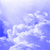 Pixelated blue and white gradient image with scattered light patches resembling clouds or abstract shapes against a soft blue background.