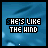 Blue-toned pixelated animation with text 'SHE'S LIKE THE WIND' over a blurred background, showing subtle light particle movement.