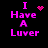 Pixelated pink text "I Have A Luvr" on black background with animated heart and starburst symbols replacing the 'love' symbol.