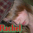 A pixelated image of a person with light brown hair and blue eyes, wearing dark clothing, with the name 'Rachel' in red text on green background at bottom left.