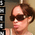 A person with brown hair and dark sunglasses appears in two side-by-side frames, the right frame showing a slightly shifted head position.