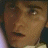 A 48x48 pixel buddy icon featuring a split composition with a partial human face on the left and "MOULIN ROUGE!" text in large red letters on the right, displayed as part of an animated contact sheet.