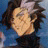 A 48x48 pixel buddy icon featuring a side-profile anime-style character with brown hair against a blue background, paired with "Anime IM" and "COM" text on a black panel.