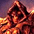 A pixelated figure in a hooded cloak with glowing eyes and fiery background, next to green text reading 'Original Icons .com' on dark green.