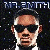 Pixelated image of a person with a bald head, dark sunglasses, and a white shirt against a dark background with scattered light specks.