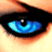 A close-up of a human eye with blue irises, black pupil, and orange-brown eyelid tones against light skin.