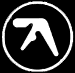 Two circular white outlines on black background; left circle contains stylized white arrow-like symbol, right circle empty.